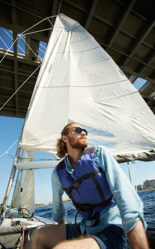 Sailor feeling freedom on boat